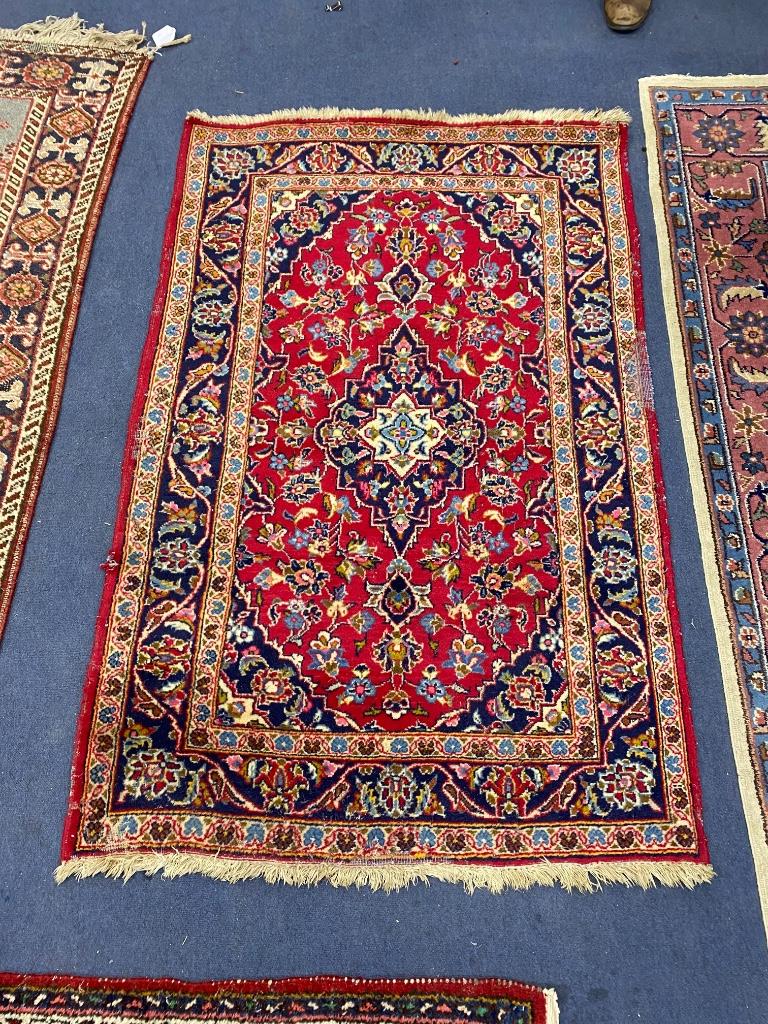 Three North West Persian rugs, largest 180 x 120cm